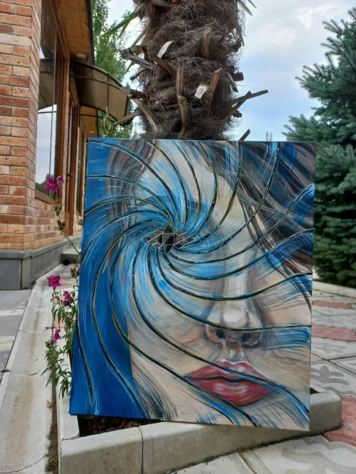 Full-view outdoor display of Mary Khachikyan's "Reflection" canvas set in an open garden setting under natural daylight.
